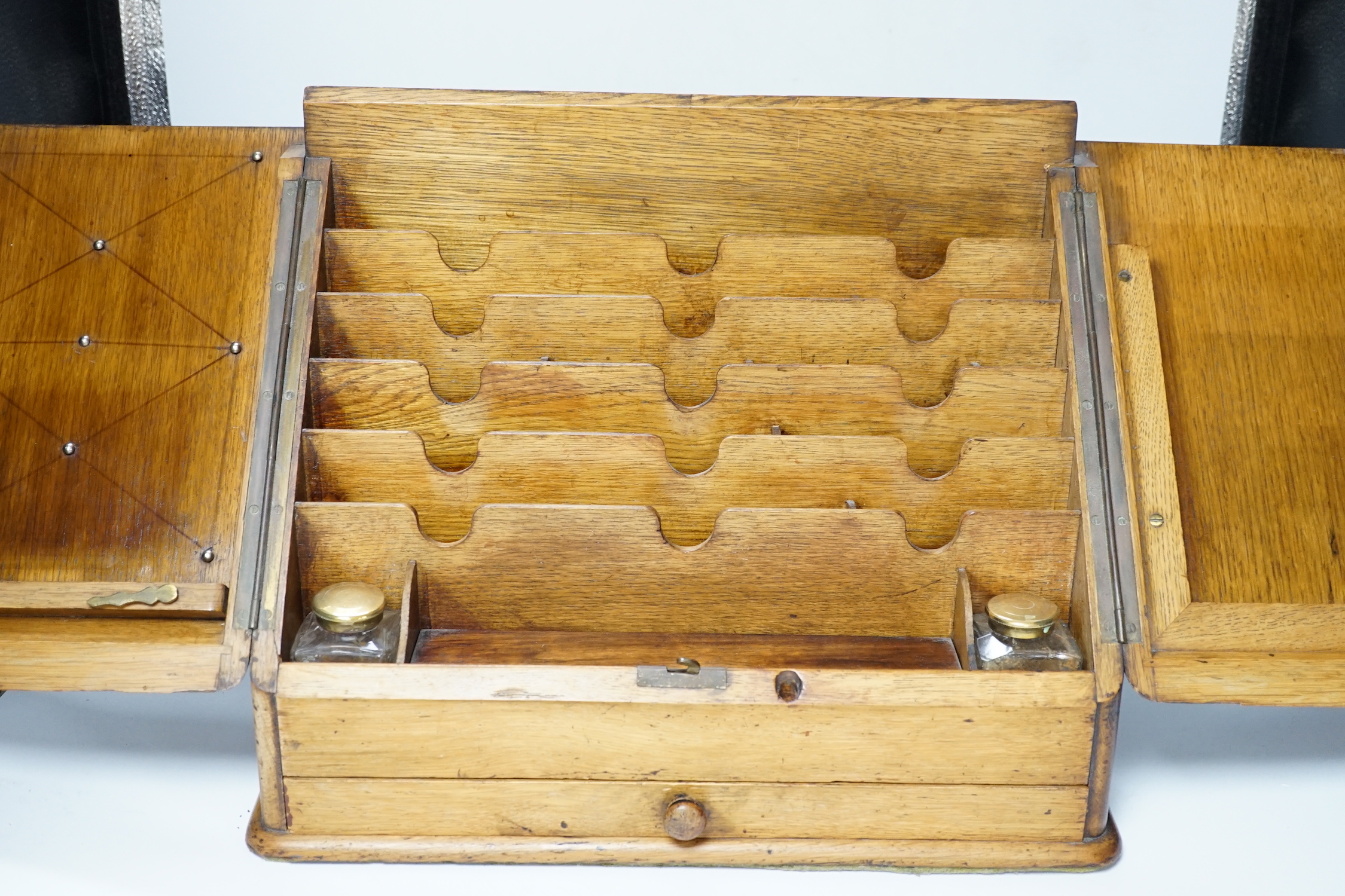 An Edwardian oak stationery casket, 31cm high, 38cm wide, 21.5cm deep